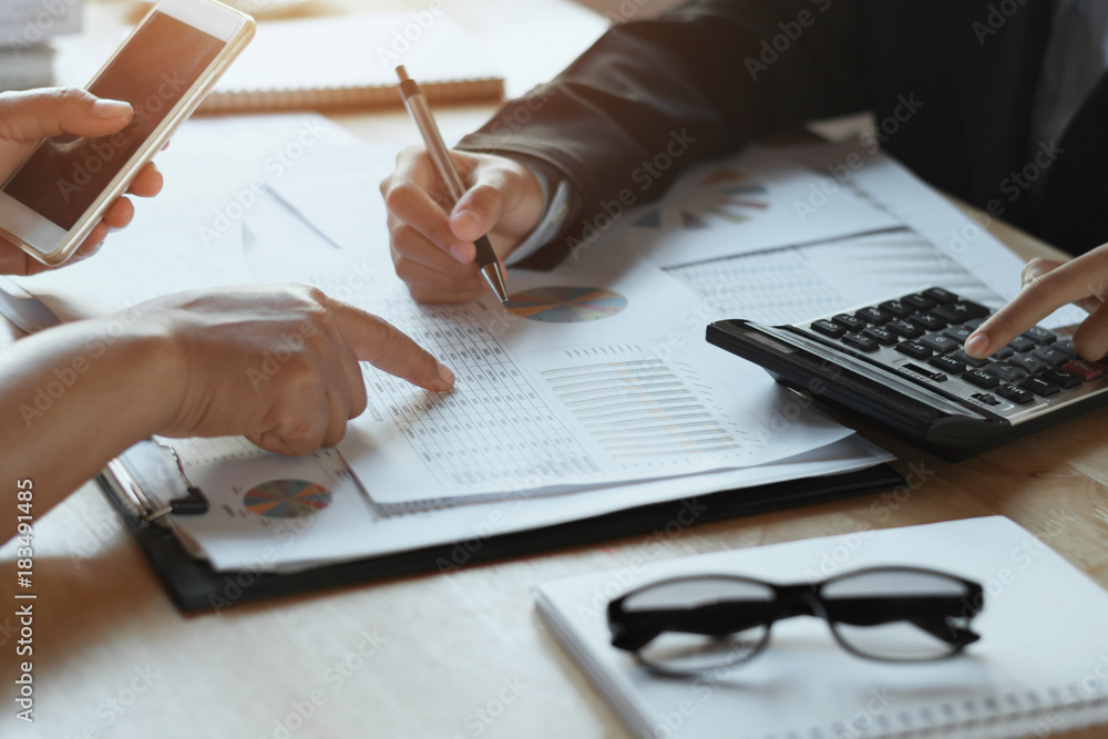 teamwork business woman checking finance report in office. accounting concept