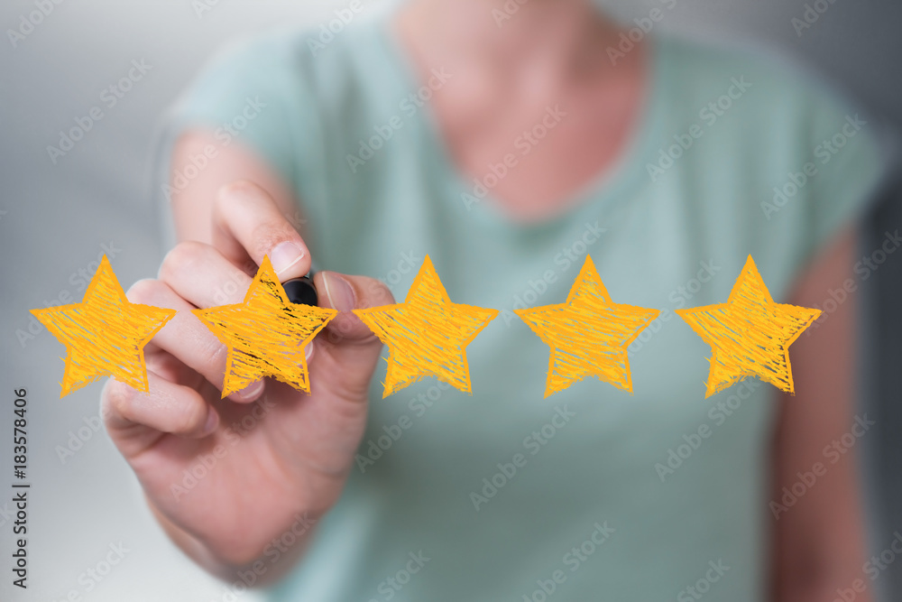 Businesswoman rating with hand drawn stars