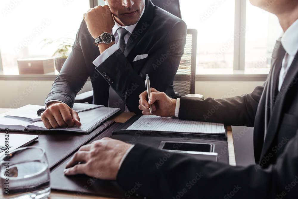 Two businessmen in a discussion at office