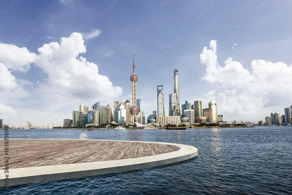 Shanghai city square wooden platform and modern commercial building scenery,China