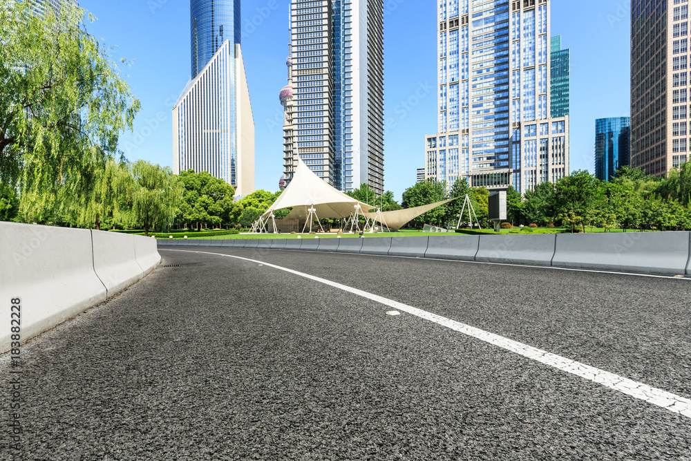 Asphalt highway and modern city commercial buildings in Shanghai,China