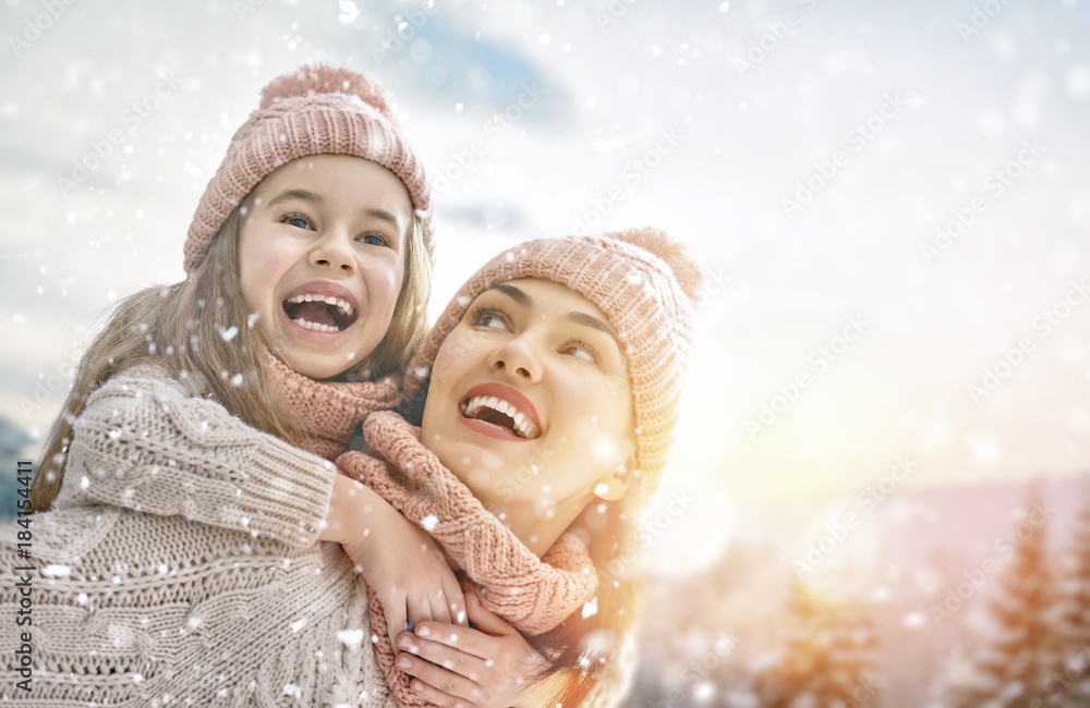 family playing on winter walk