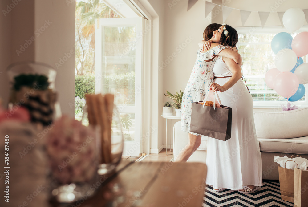 Female friends meeting for baby shower