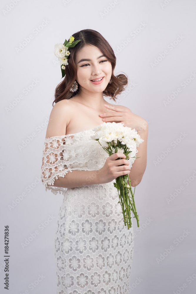 Beautiful asian woman bride on grey background. Closeup portraits with a professional makeup