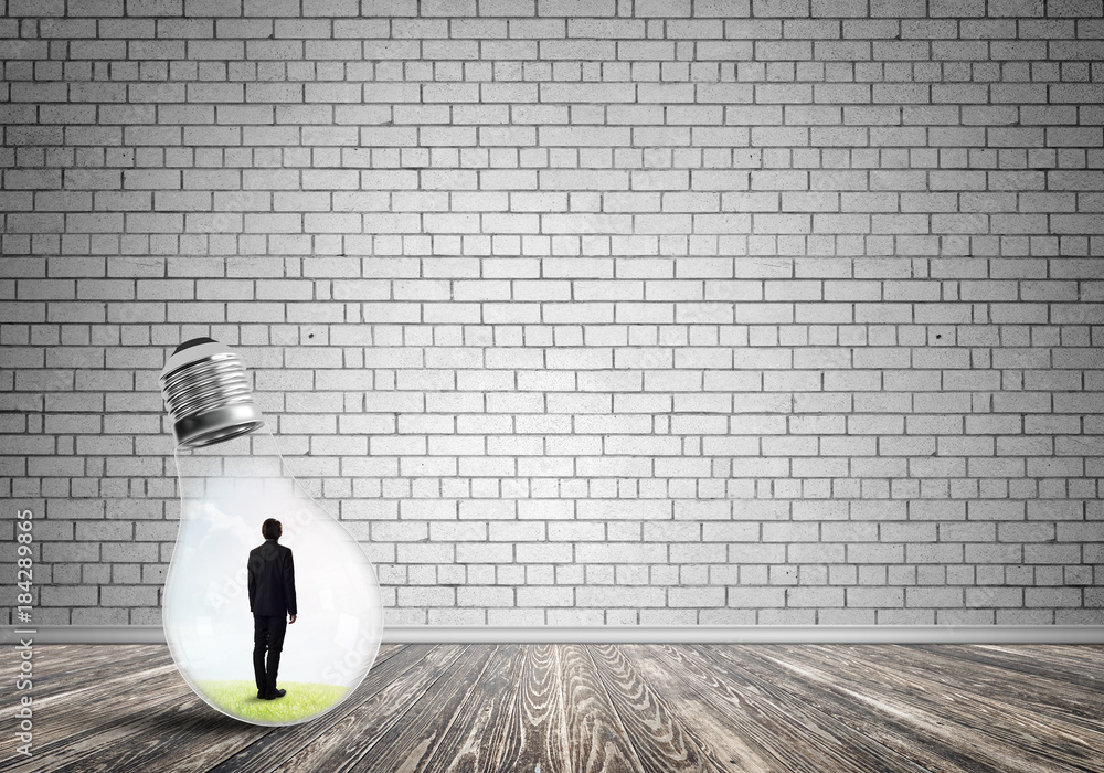 Businessman trapped in bulb