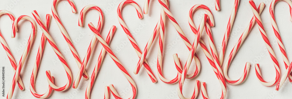 Christmas holiday red candy cane pattern, texture and background on white background, flat-lay, copy