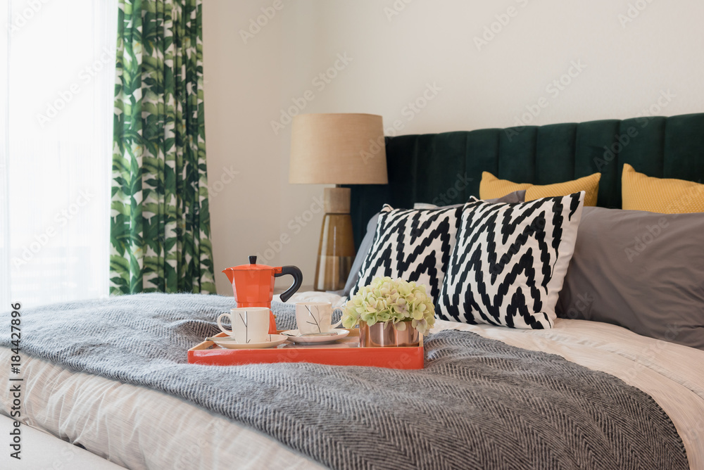 set of cup of tea on tray in classic bedroom