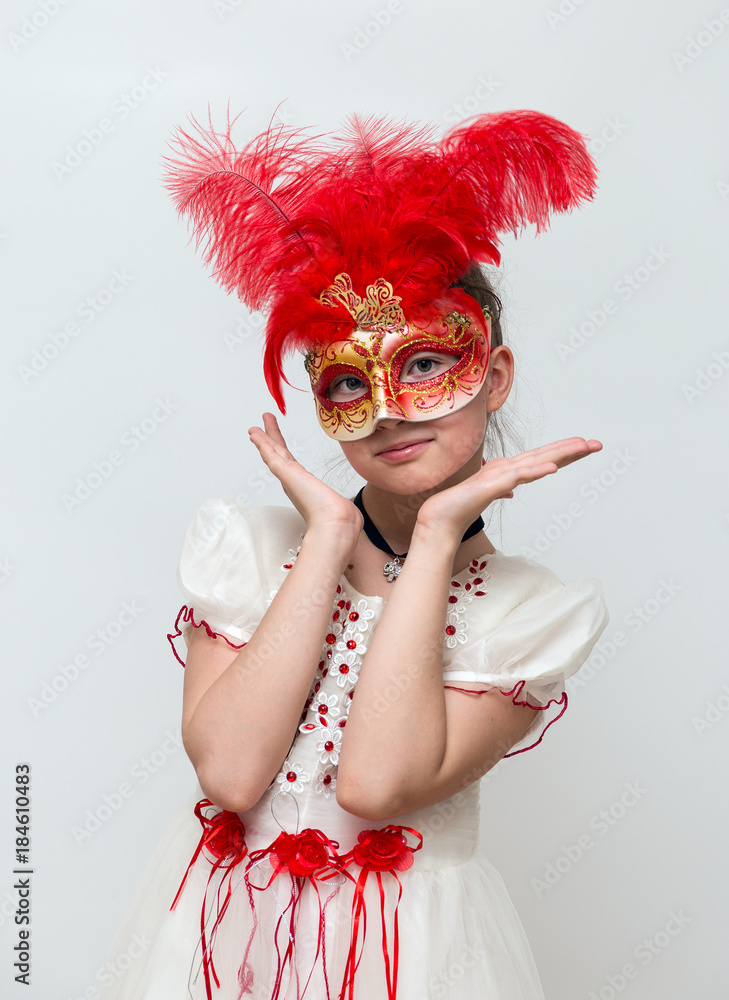 Adorable little girl with Venetian carnival mask