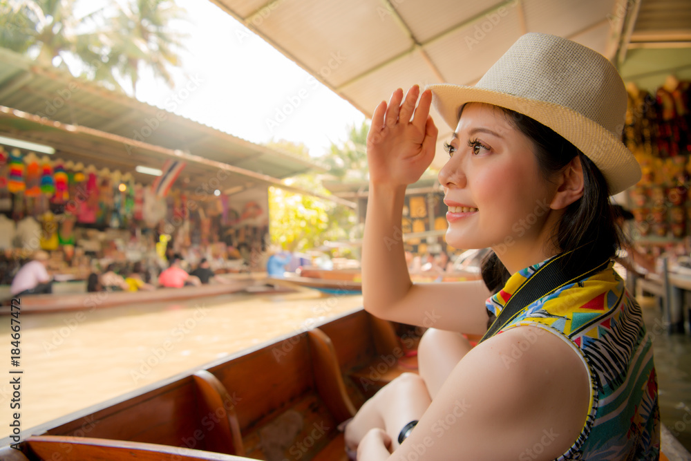 attractive woman traveler taking local river boat