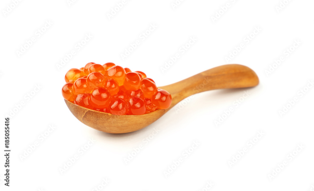 Wooden spoon of red salmon caviar close up