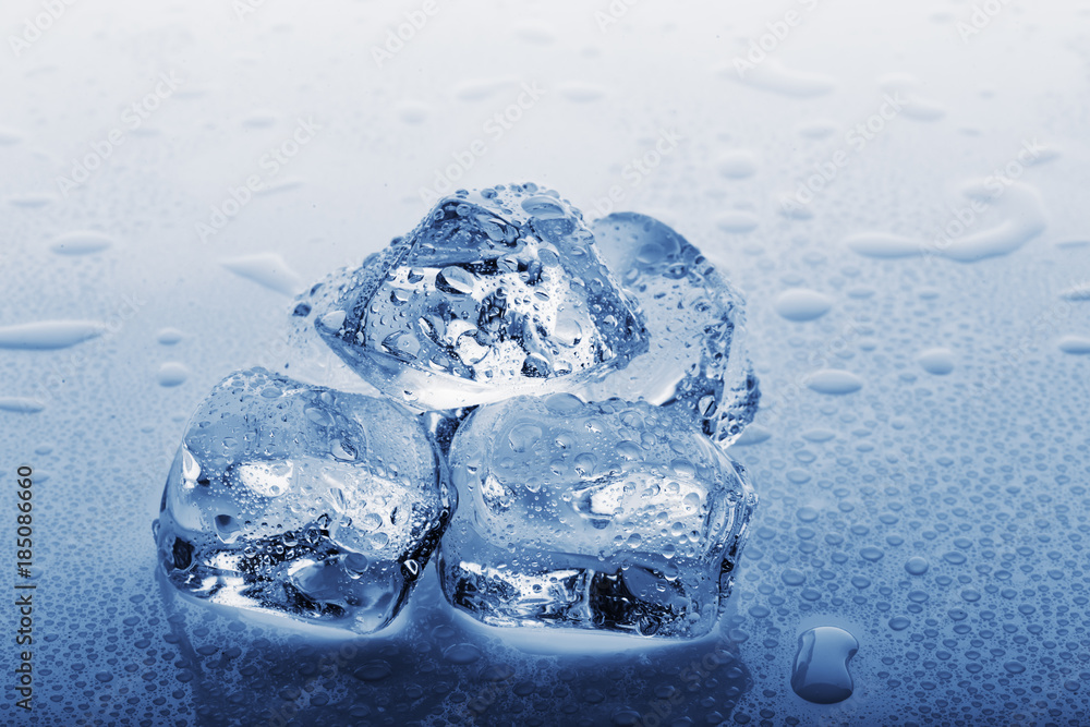 Frozen large ice cubes in droplets of water