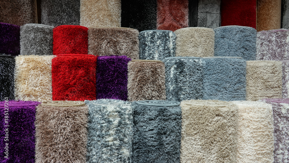 Carpets variety selection rolled up rugs shop store