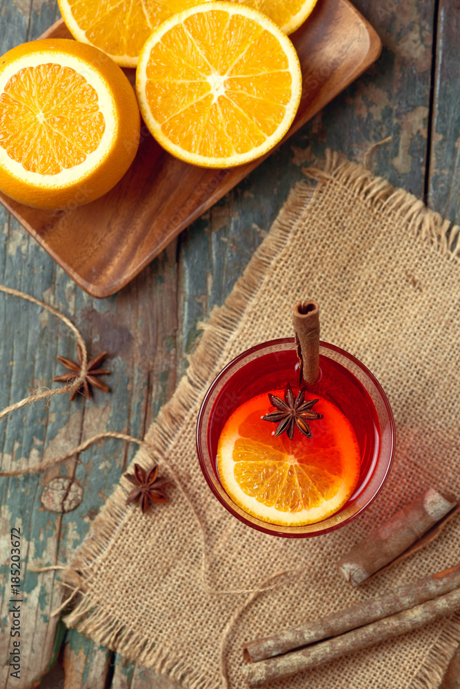 Christmas mulled wine on a rustic wooden table. Holidays concept.