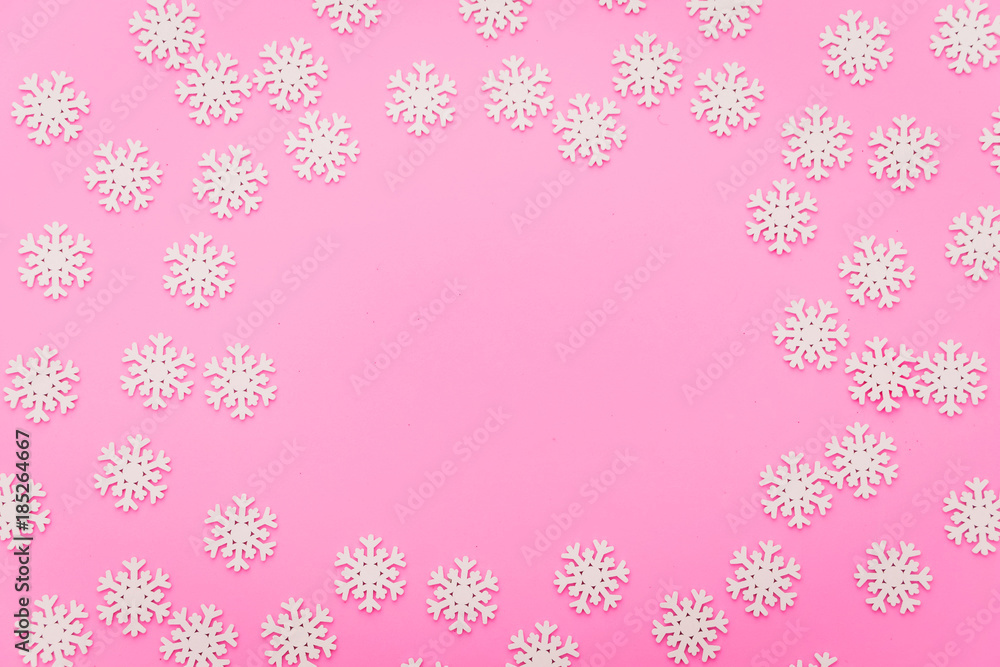 snow flake arrange flat lay on pink color background