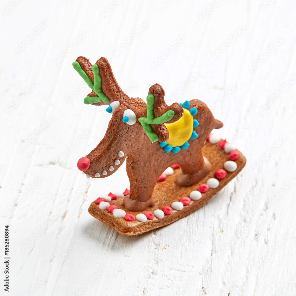 gingerbread deer on white wooden table