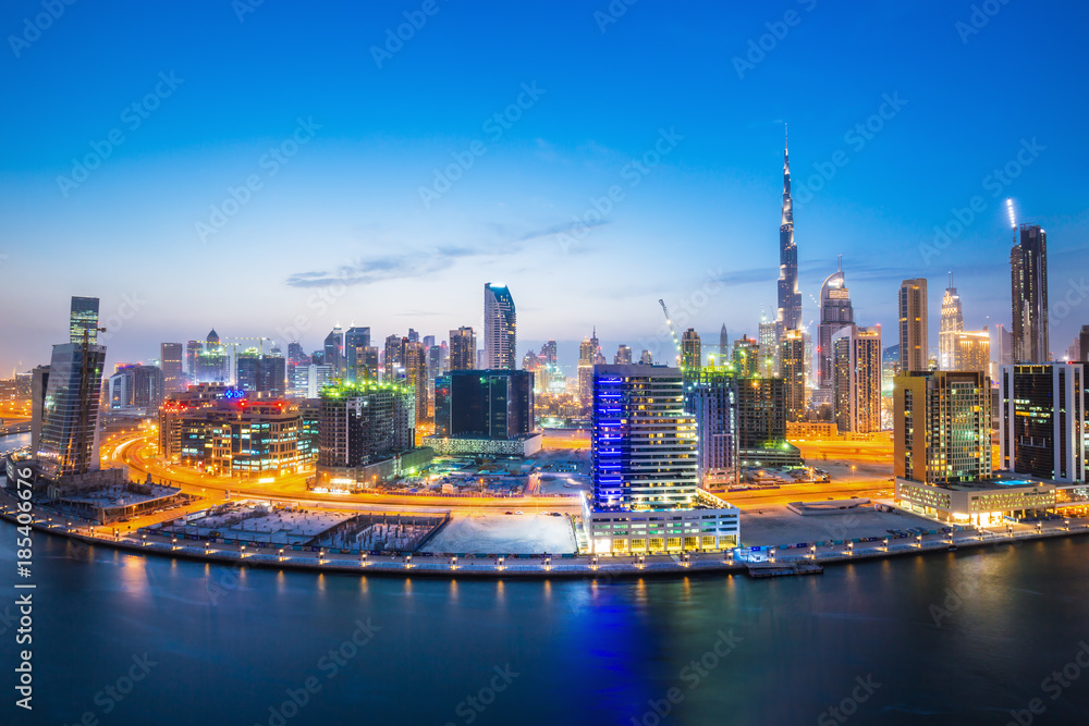 Dubai downtown and water canal with promenade after the sunset,Dubai,United Arab Emirates