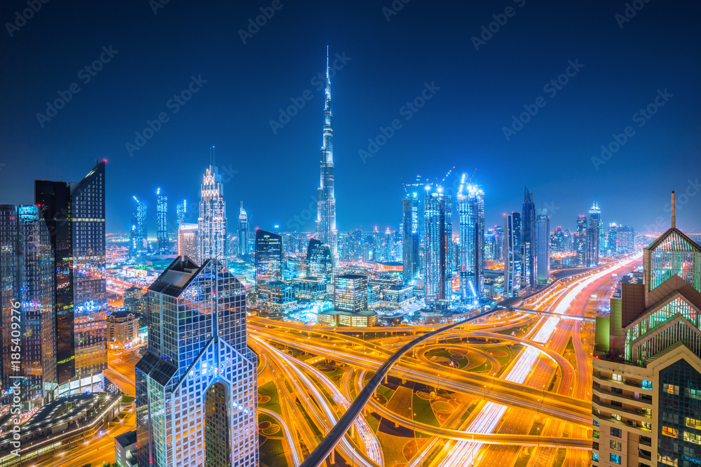 Dubai skyline at sunset with beautiful city center lights and Sheikh Zayed road traffic, Dubai, Unit