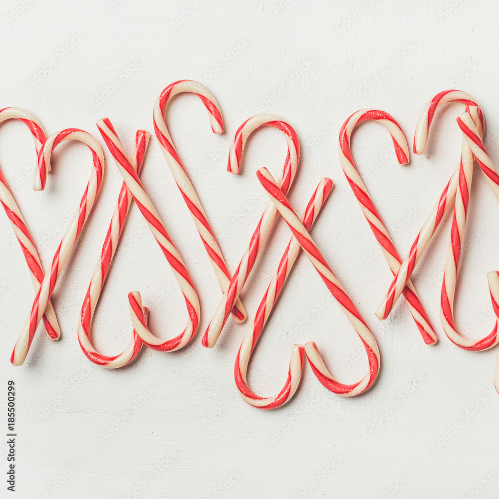 Christmas holiday red candy cane pattern, texture and background on white background, flat-lay, squa