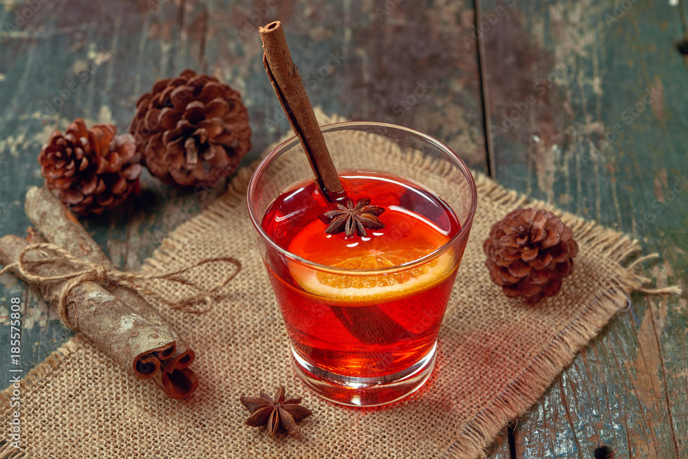 Christmas mulled wine on a rustic wooden table. Holidays concept.