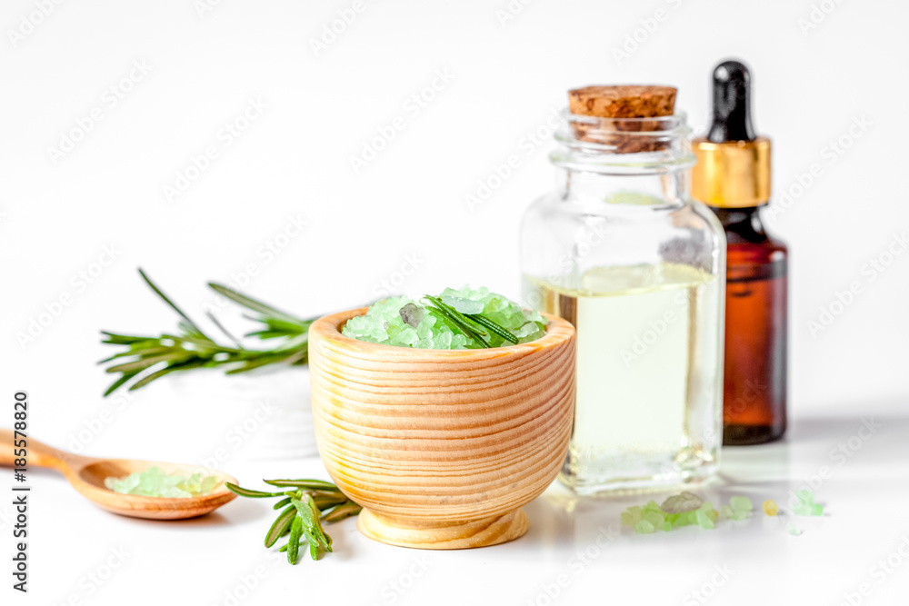 organic cosmetics with extracts of herbs rosemary on white backg