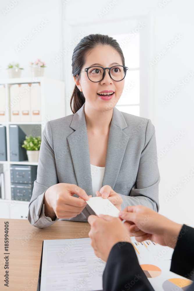 company agent exchanging personal business card