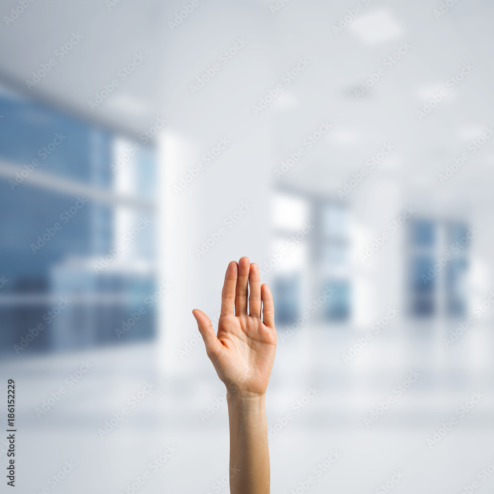 Choosing gesture of person in elegant modern interior in sunshine light