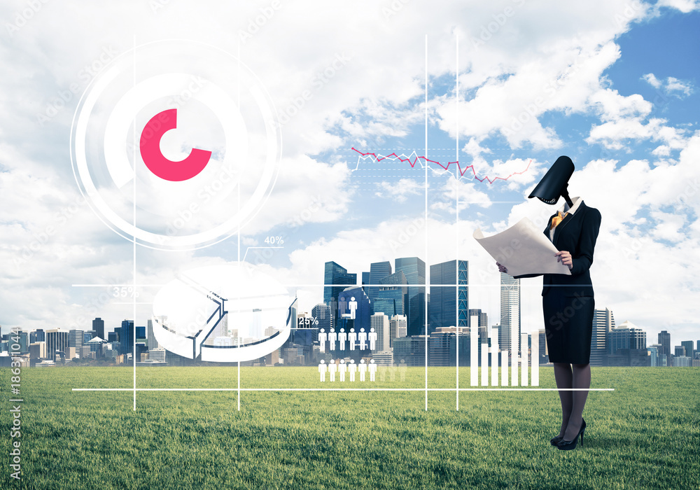 Camera headed woman standing on green grass against modern citys