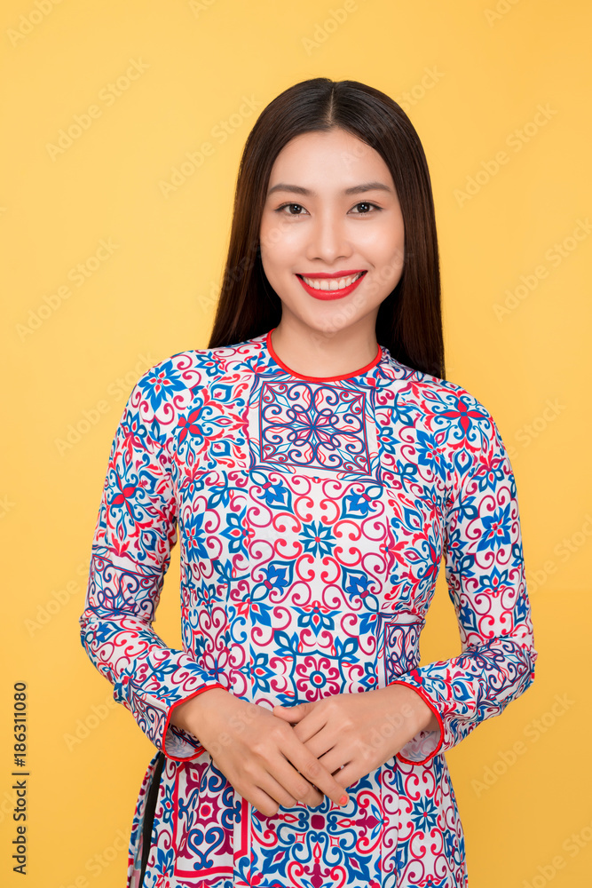 Vietnamese woman traditional festival costume Ao Dai. Tet holiday. Lunar New Year.