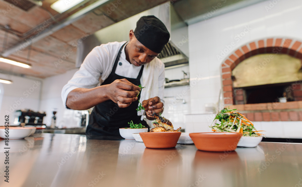 Chef cooking food at commercial kitchen