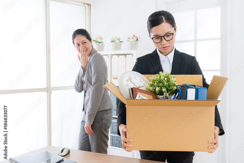 business girl holding personal belongings box