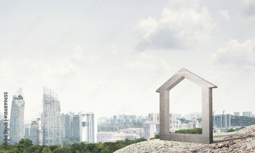 山丘上的混凝土住宅标志和背景自然景观的概念图