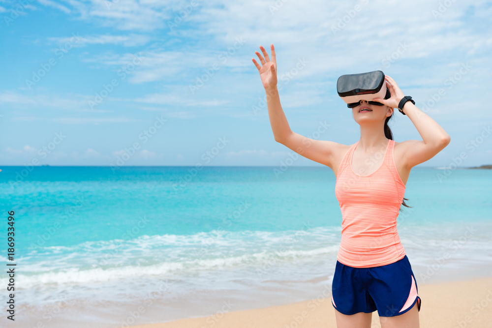 smiling beauty girl jogger wearing VR technology