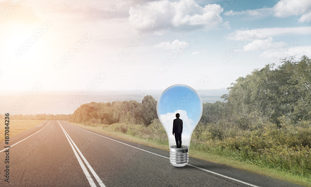 Businessman inside light bulb