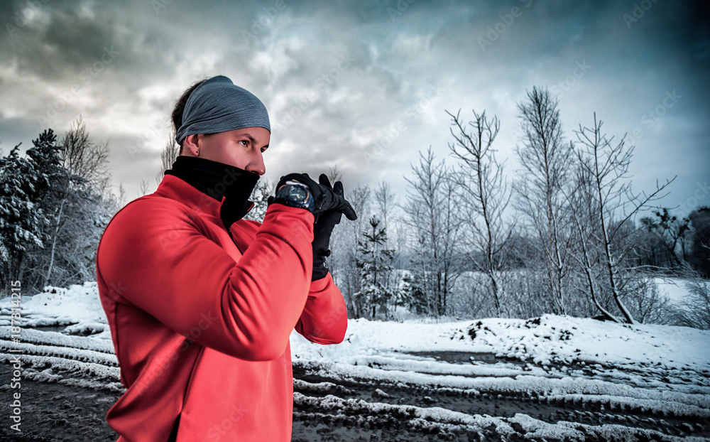 Preparing before running in dirty puddle at winter, outdoor exercise