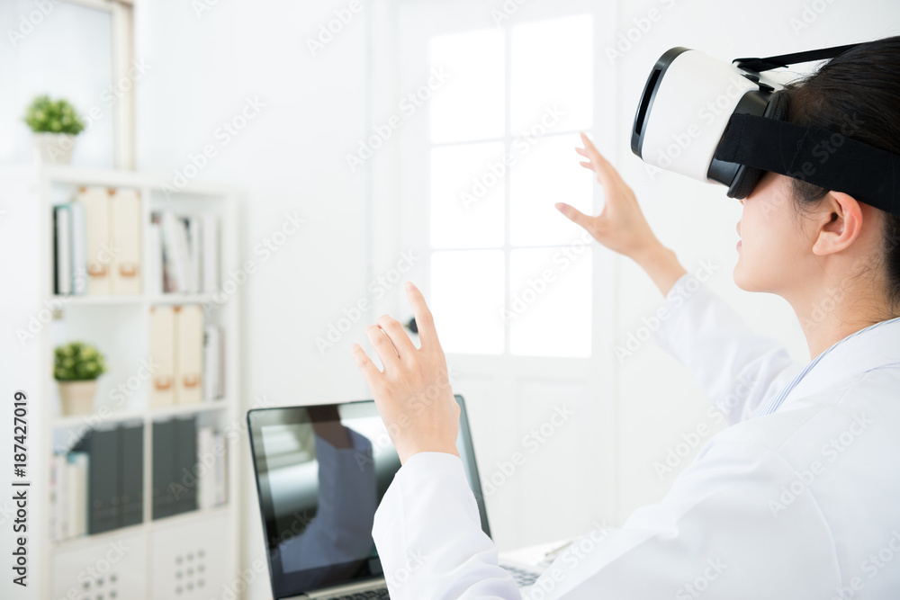 beauty young female doctor wearing VR technology