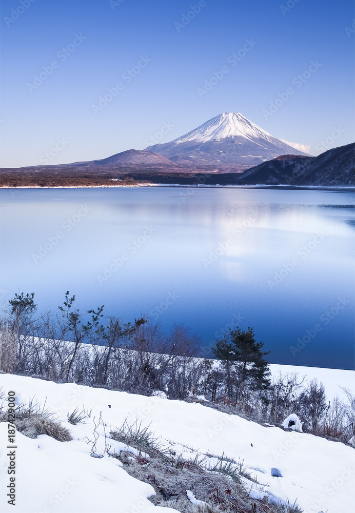 Mountain Fuji and Motosu lake with snow fall in winter season