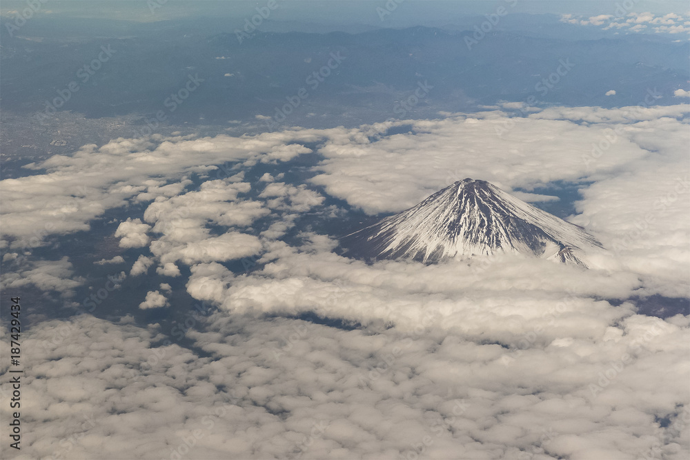 Top of Mountain Fuji with snow in winter season , taken from on airplane after takeoff from Tokyo Ha