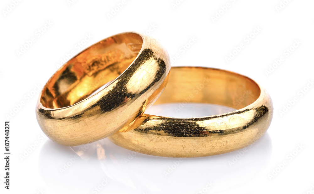 Golden wedding rings isolated on a white