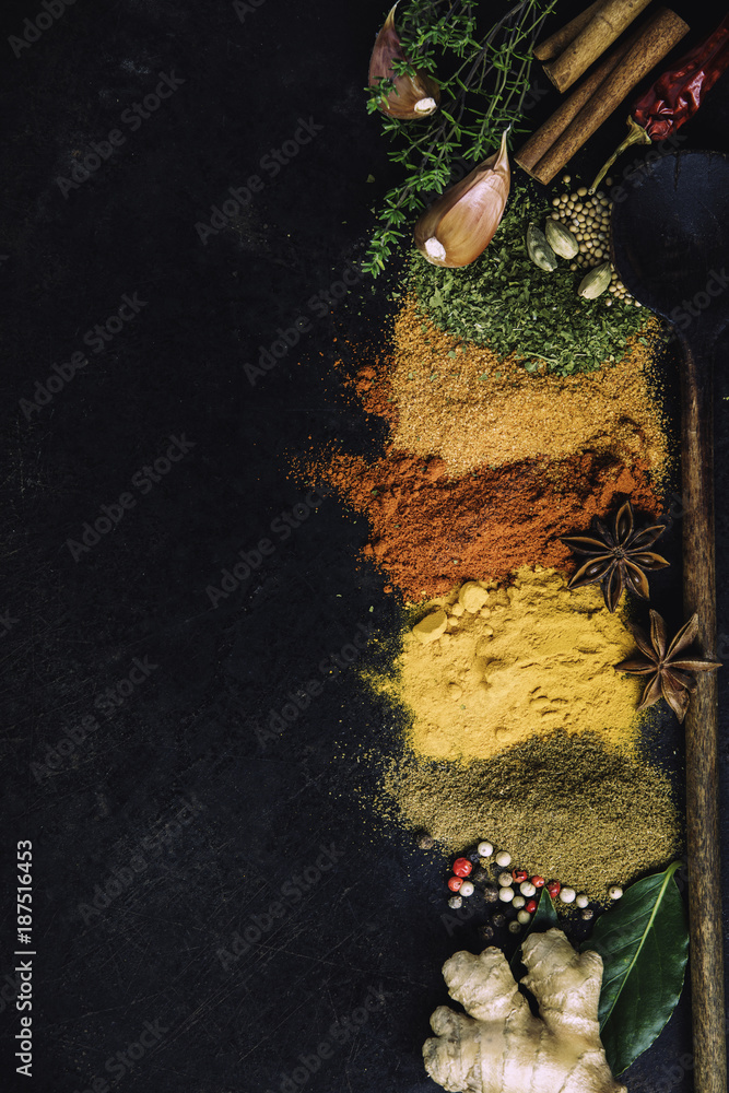 Spices and herbs on a dark background