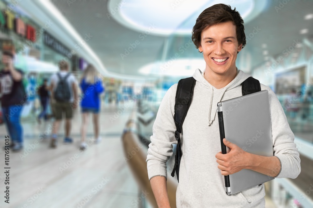 Male student with laptop