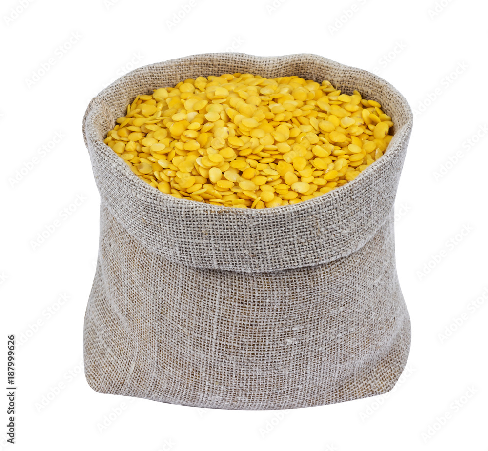 Yellow lentils in bag isolated on white background