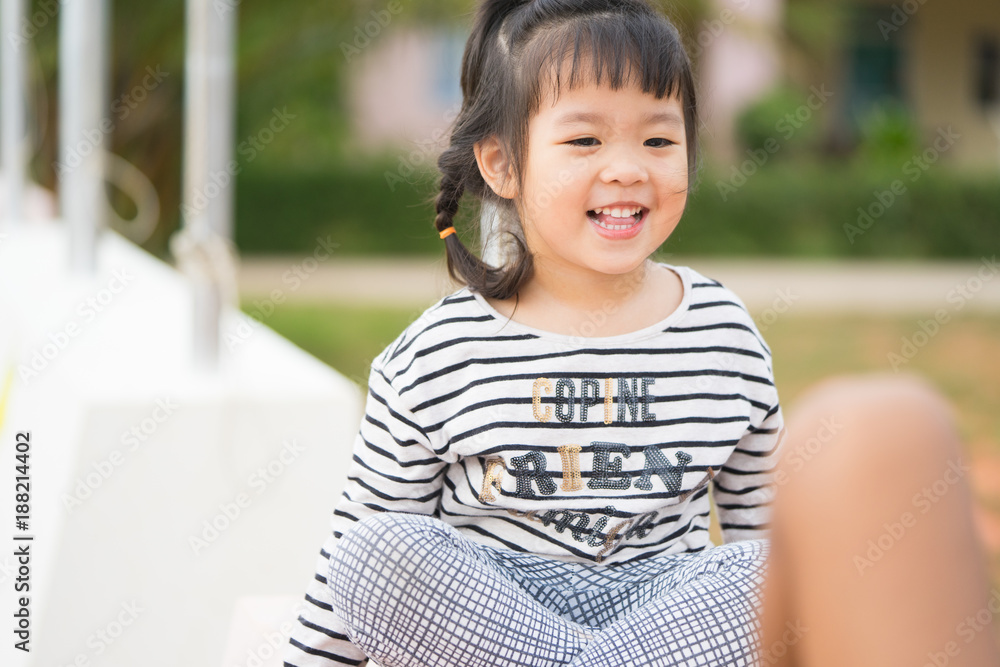 Little asian girls playing with her friend outdoor in daycare