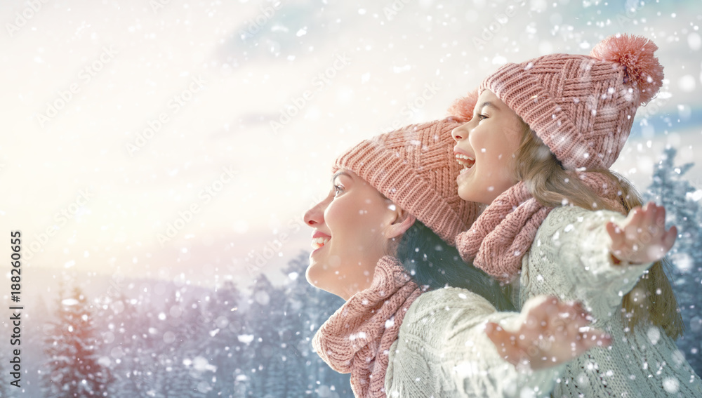 family playing on winter walk