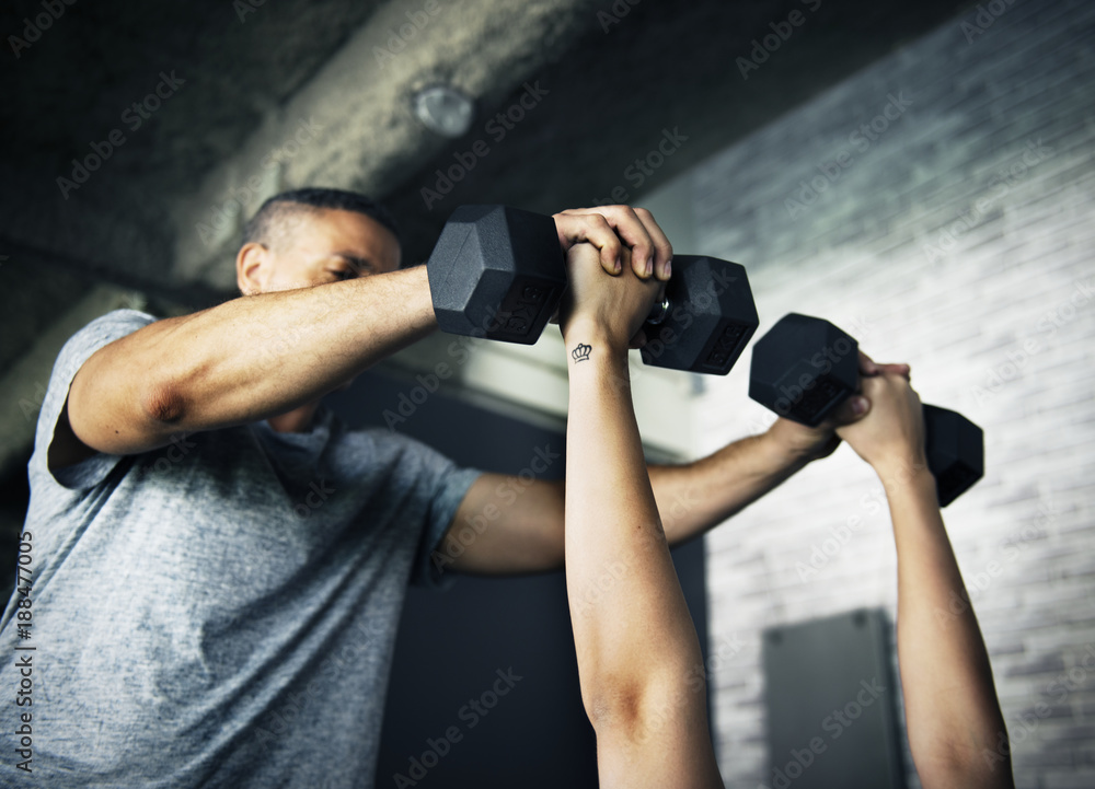 People exercising at fitness gym