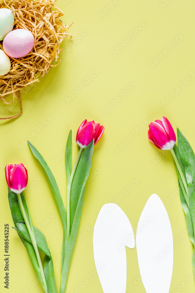 Easter concept on yellow background top view mockup