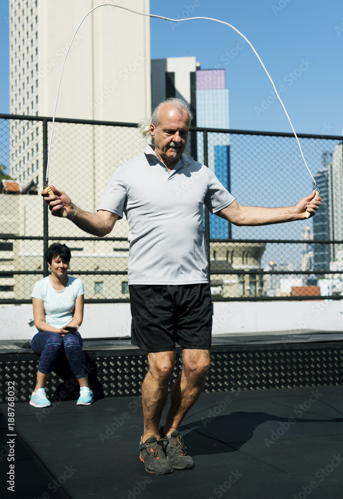 People exercising at fitness gym