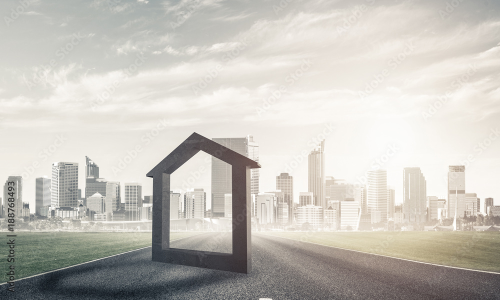 Conceptual background image of concrete home sign on asphalt roa