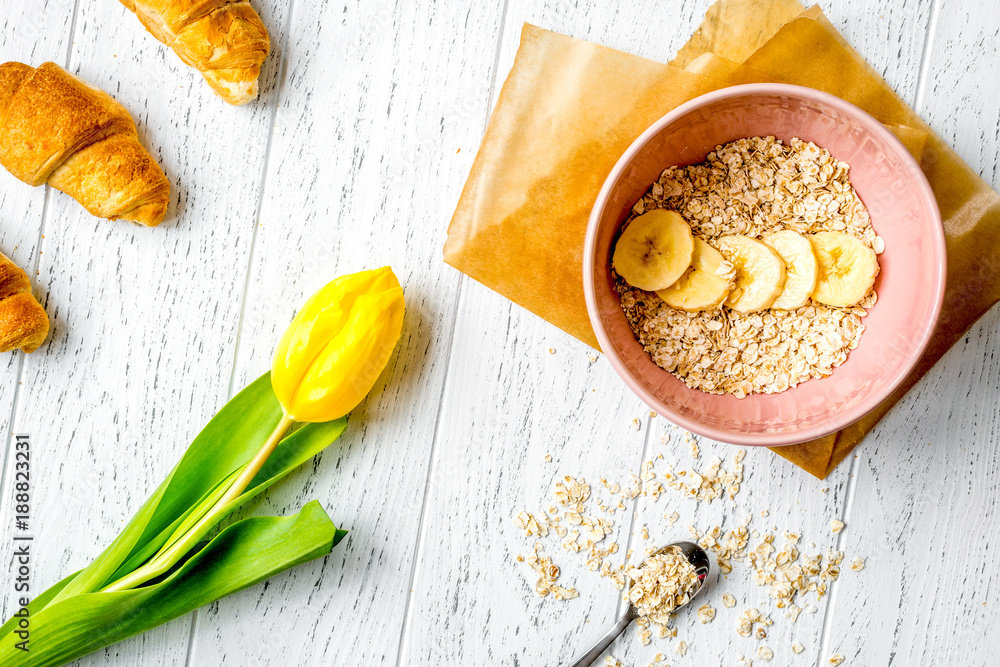 healthy breakfast with porridge on wooden background top view