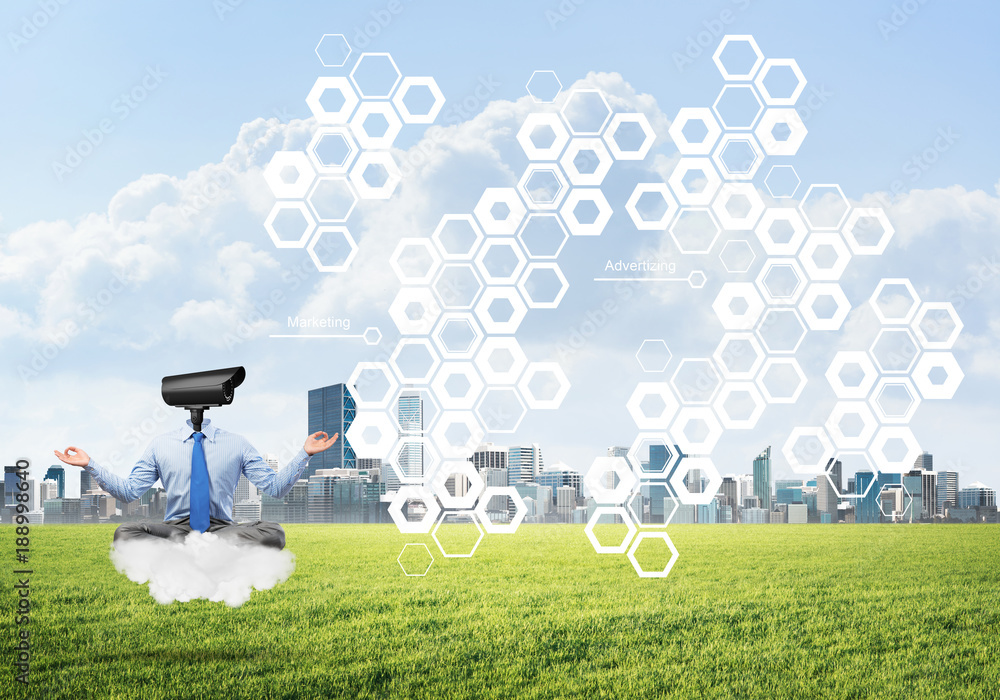 Camera headed man sitting in lotus pose on cloud against modern cityscape