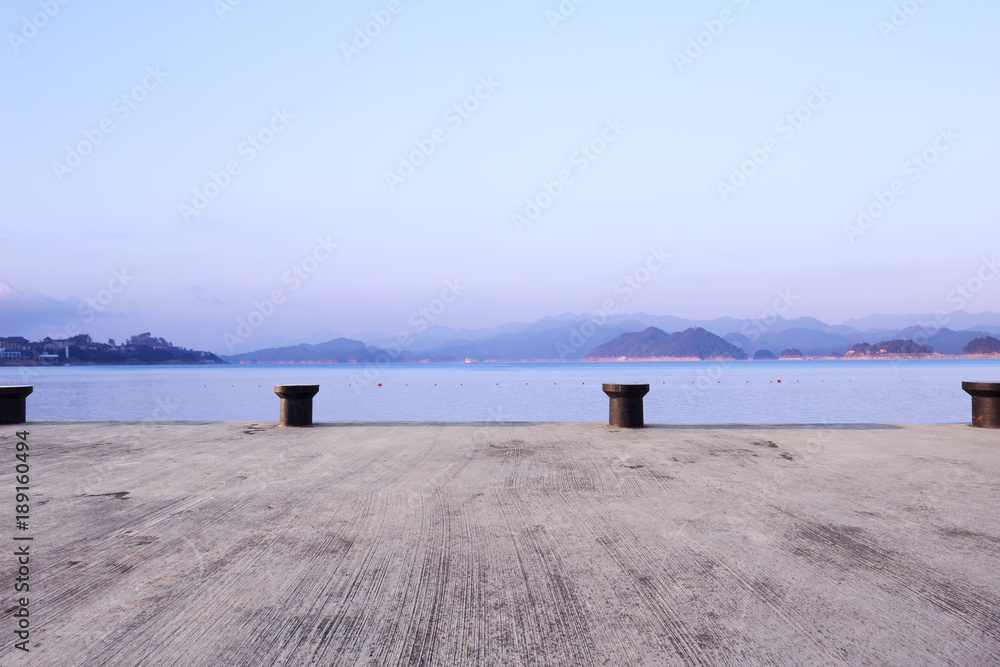 empty concrete floor with beautiful lake